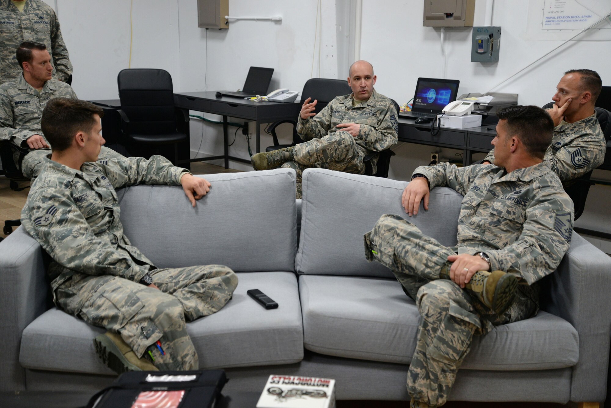 U.S. Air Force Chief Master Sgt. Curtis Stanley, 100th Air Refueling Wing command chief, speaks with 100th Aircraft Maintenance Squadron Airmen March 16, 2016, during his visit to Naval Station Rota, Spain. Stanley and U.S. Air Force Col. Thomas Torkelson, 100th Air Refueling Wing commander toured facilities where Airmen work to see how they are settling in. (U.S. Air Force photo by Senior Airman Christine Halan)
