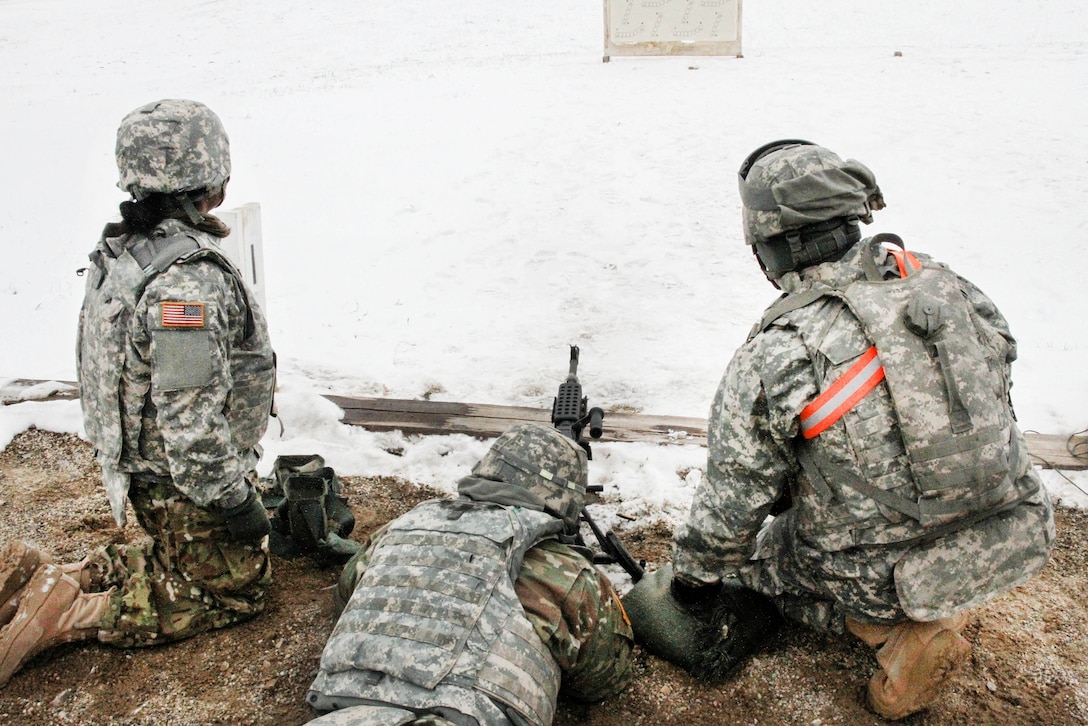 An Army reservist fires an M240B machine gun during Operation Cold Steel at Fort McCoy, Wis., March 13, 2017. Army Reserve photo by Staff Sgt. Debralee Best