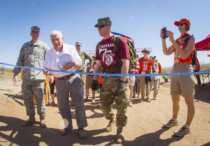 Ben Skardon, 99, a retired Army colonel and a survivor of the Bataan Death March, crosses the eight-and-a-half mile finish line at the Bataan Memorial Death March observance at White Sands Missile Range, N.M., March 19, 2017. Army photo by Staff Sgt. Ken Scar
