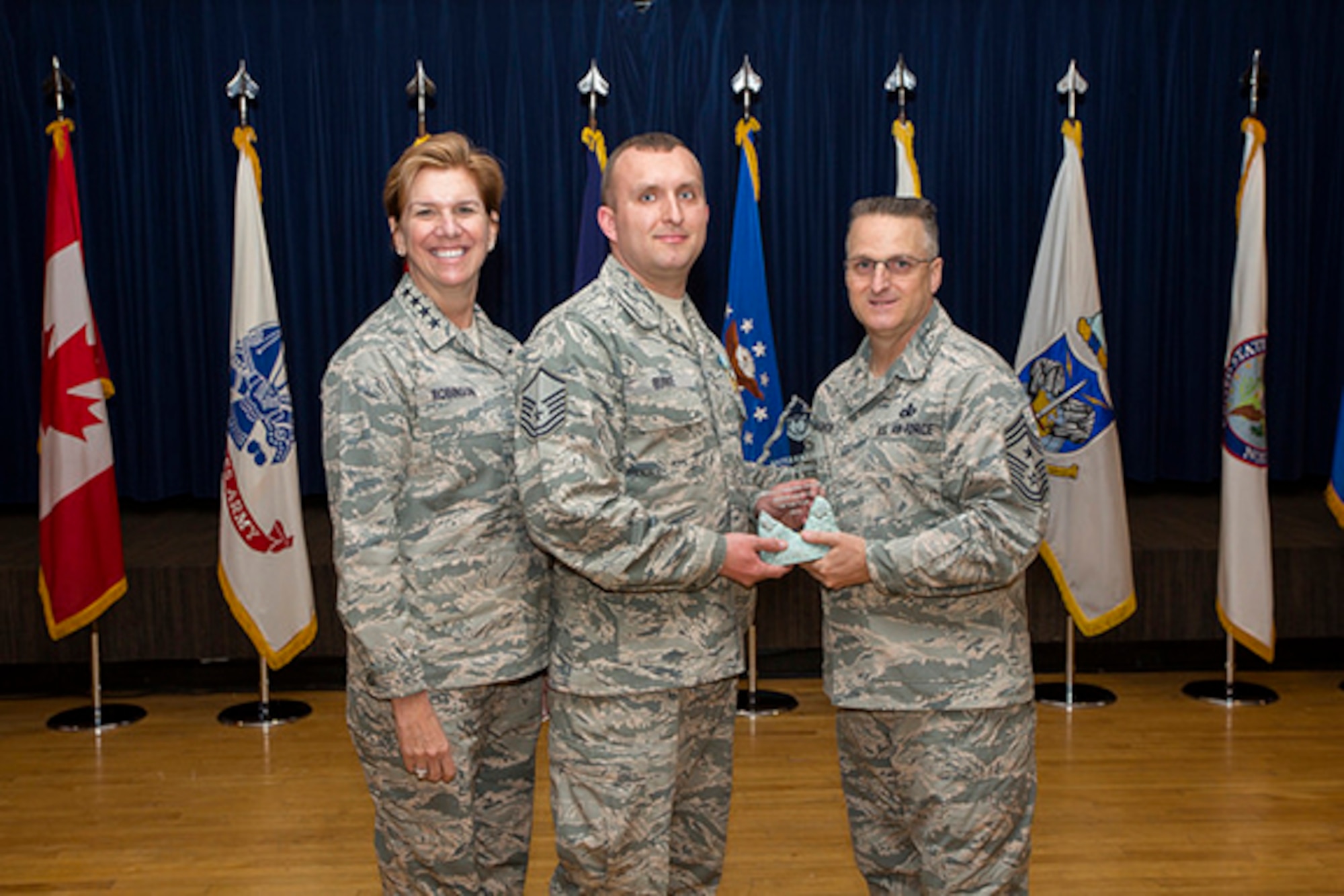 Master Sgt. James Burke of the 224th ADG received NORAD Senior NCO of the Year award on March 14 from NORAD Commander Gen. Lori Robinson and NORAD Command SEL Chief Master Sgt. Harold Hutchison. Photo courtesy of NORAD Public Affairs. 