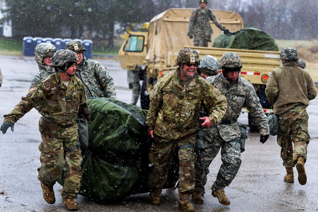 South Carolina Army National Guard members drag a decontamination and triage kit to a setup point during a U.S. Army North joint training exercise in Owings Mills, Md., March 10, 2017. The soldiers are assigned to the South Carolina Army National Guard’s 251st Area Support Medical Company. Air National Guard photo by Tech. Sgt. Jorge Intriago