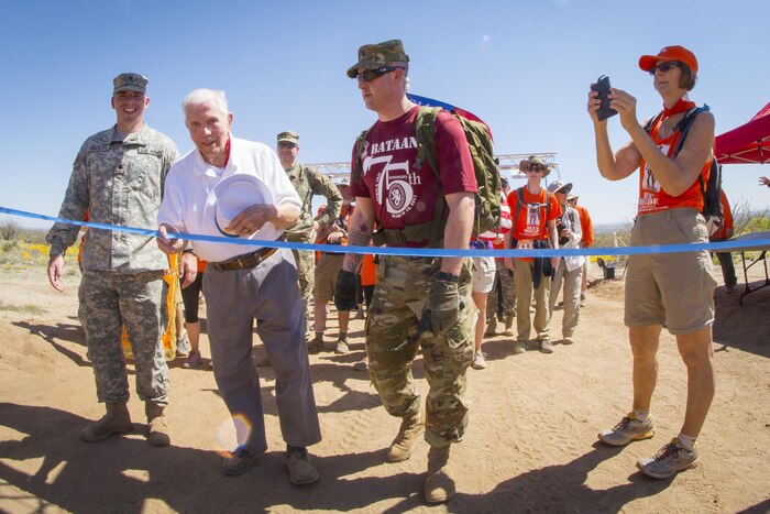Retired U.S. Army Col. Ben Skardon, 99, a survivor of the Bataan Death March, crosses the eight-and-a-half mile finish line of the 28th annual Bataan Memorial Death March at White Sands Missile Range, March 19, 2017. Army Reserve photo by Staff Sgt. Ken Scar