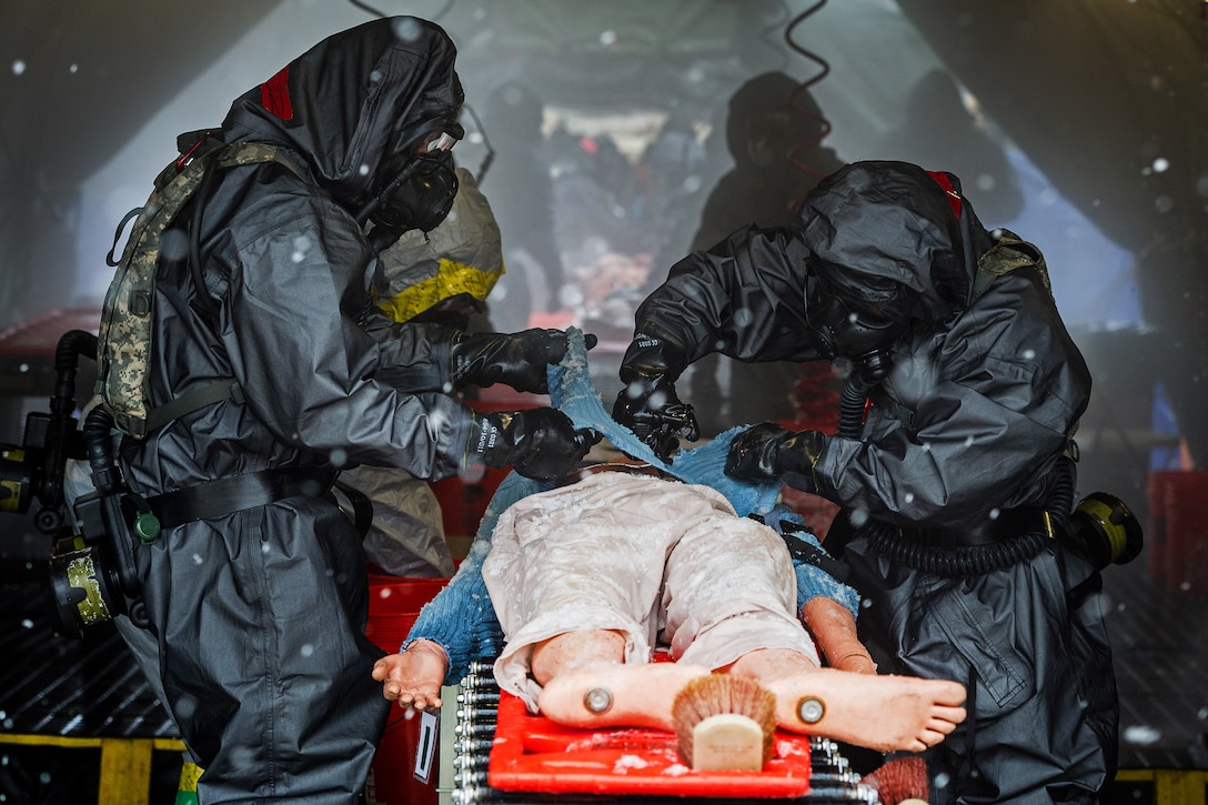 South Carolina Army National Guard members decontaminate a mock patient during a U.S. Army North joint training exercise in Owings Mills, Md., March 10, 2017. Air National Guard photo by Tech. Sgt. Jorge Intriago