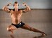 Tommy Kreitzer strikes a pose during his Classic Men's Physique category judging at the Eglin Bodybuilding Classic contest March 18 at Eglin Air Force Base, Fla.  Four men and 10 women competed in various categories highlighting their fit and sculpted physiques. (U.S. Air Force photo/Samuel King Jr.)