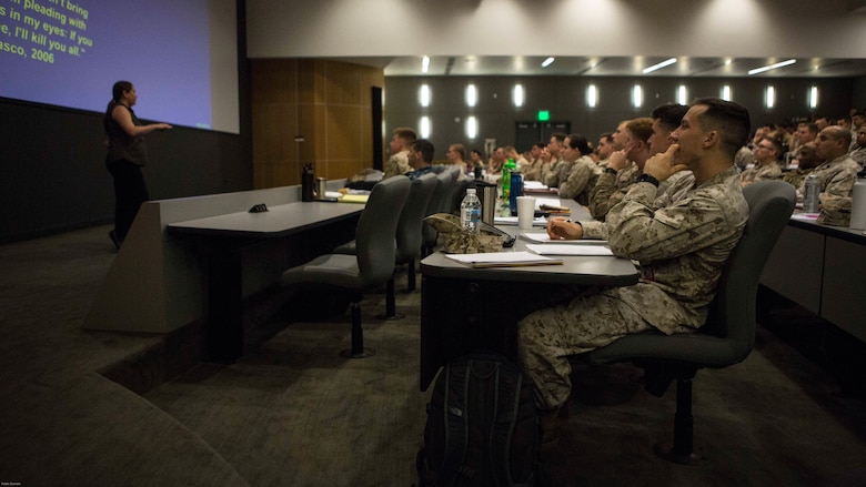 Dr. Sara Russell, Center for Naval Analyses representative and industrial psychologist addresses students attending Weapons and Tactics Instructor Course 2-17 and Marine Aviation Weapons and Tactics Squadron One staff during a tactical risk management period of instruction at Marine Corps Air Station Yuma, Ariz., March 15, 2017.  WTI is a seven week event hosted by MAWTS-1. MAWTS-1 provides standardized tactical training and certification of unit instructor qualifications to support Marine Aviation Training and Readiness and assists in developing and employing Aviation Weapons and Tactics. 