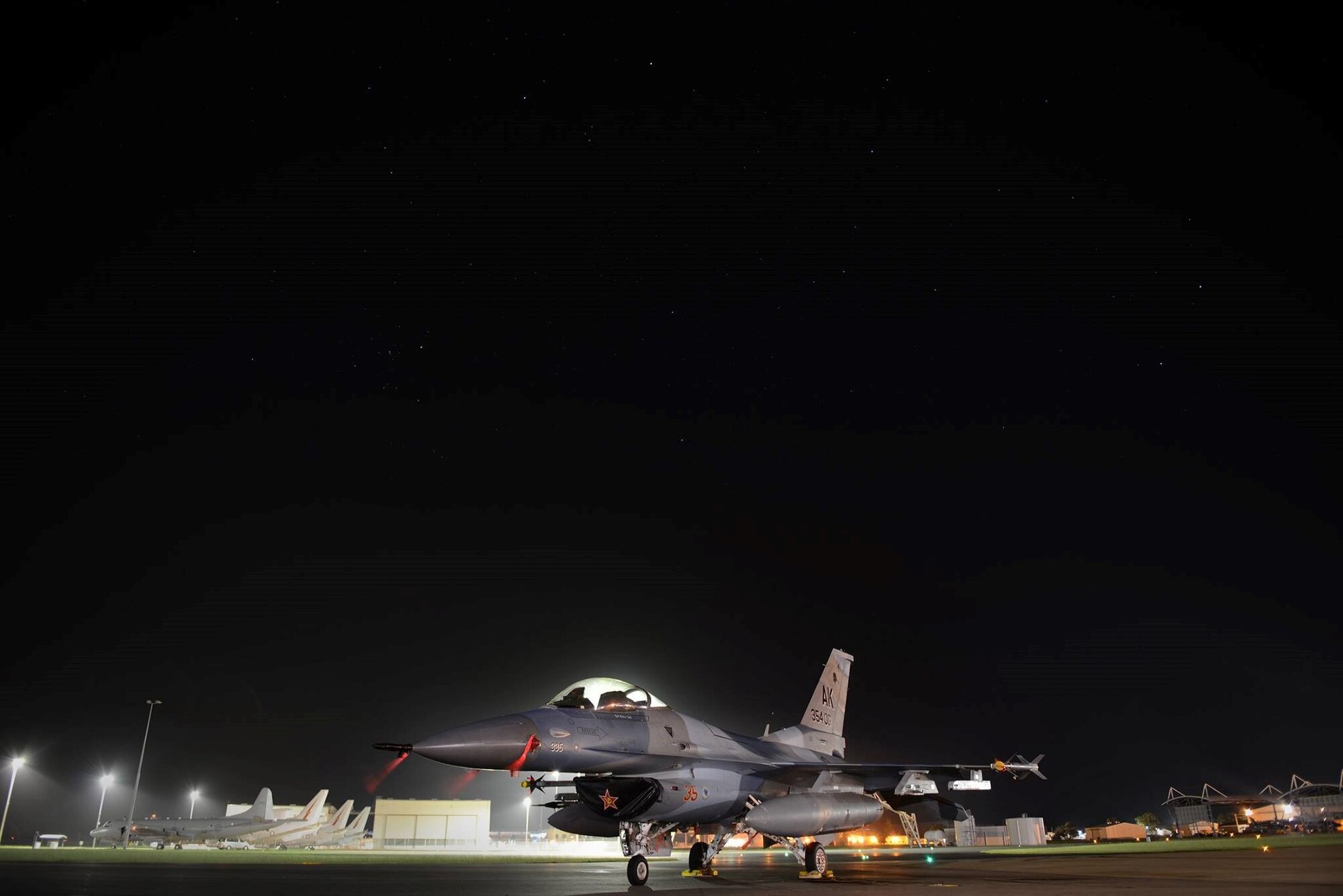 The U.S. Air Force 354th Operations Group F-16 Fighting Falcon flagship sits on the tarmac at Royal Australian Air Force Base Williamtown, in New South Wales, Australia, March 19, 2017. Exercise Diamond Shield 2017, the second of four Diamond Series exercises conducted by the RAAF Air Warfare Centre, is an Australian Defence Force training activity where high-readiness forces deploy quickly to remote locations in Australia in response to a simulated security threat. The exercise will see members of the ADF Navy, Army and Air Force rapidly deploy to counter a fictitious force posing a threat to Australia's national security in the Kimberley region in North Western Australia. (U.S. Air Force photo by Tech. Sgt. Steven R. Doty) 