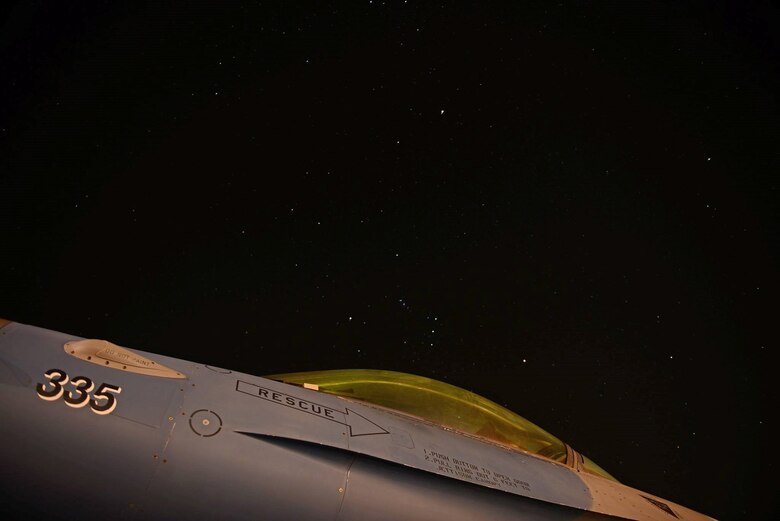 A U.S. Air Force F-16 Fighting Falcon sits under the night sky at Royal Australian Air Force Base Williamtown, in New South Wales, Australia, March 19, 2017. Exercise DS17 runs from March 13 to March 31 and will incorporate the RAAF C-17A III Globemaster, C-130J Hercules, AP-3C Orion, and Eielson Air Force Base’s signature Aggressor F-16 Fighting Falcon’s. (U.S. Air Force photo by Tech. Sgt. Steven R. Doty) 