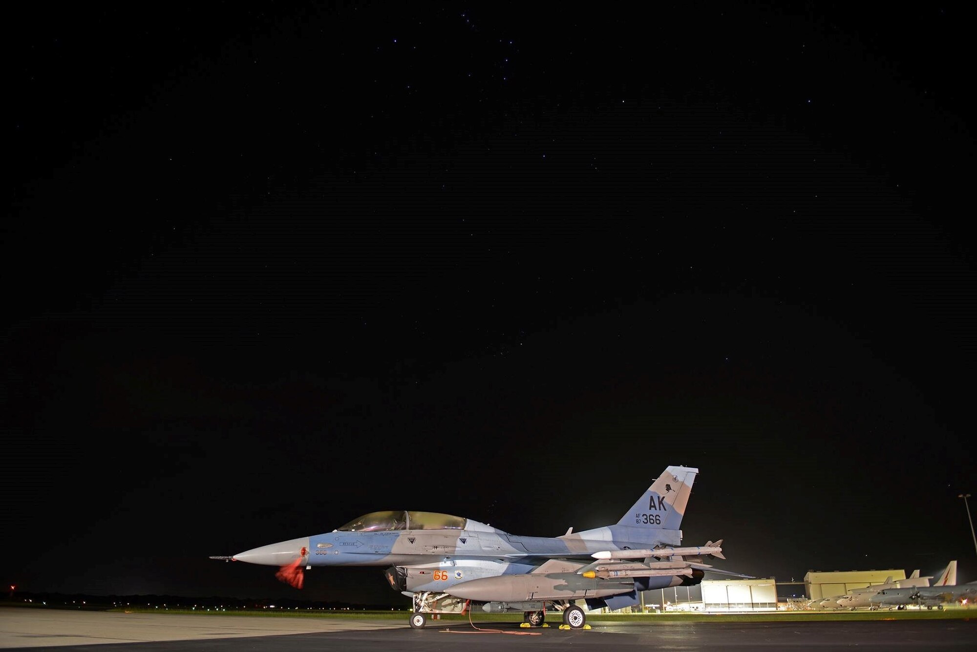 A U.S. Air Force F-16 Fighting Falcon sits under the night sky at Royal Australian Air Force Base Williamtown, in New South Wales, Australia, March 19, 2017. As a benchmark for aerial combat training through its annual series of Red Flag-Alaska exercises, integration of Eielson’s 18th Aggressor pilot’s enhances interoperability and ensures the RAAF can operate in a combined environment to respond to any contingency in the region and provide an agile, decisive and effective deterrent to any future challenges. (U.S. Air Force photo by Tech. Sgt. Steven R. Doty) 