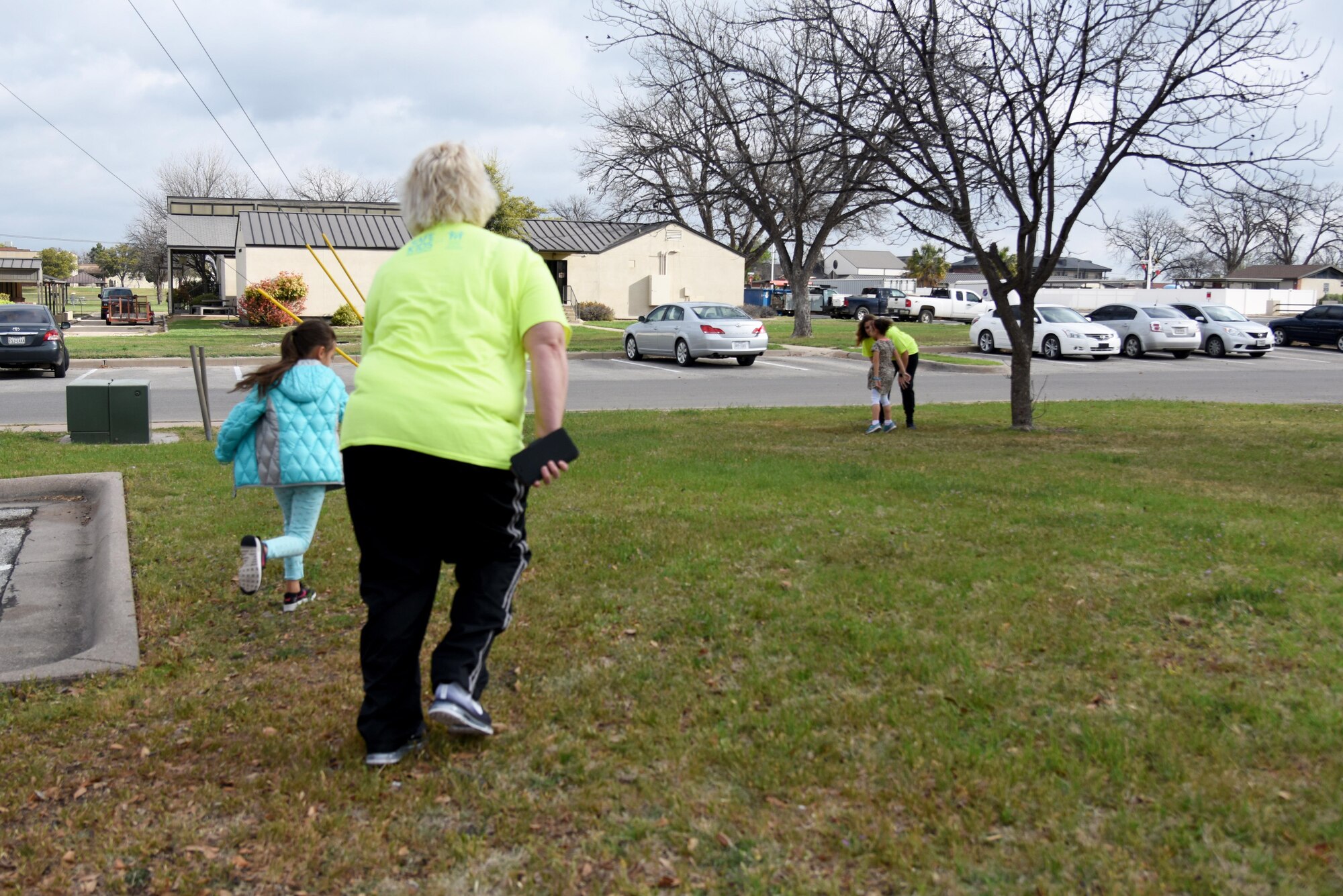 Catie Widenhofer, radKIDs instructor, chases after a child during a radKIDS class at the Youth Center on Goodfellow Air Force Base, Texas, March 16, 2017. Widenhofer teaches the radKIDs class to run to someone they trust when approached by strangers. (U.S. Air Force photos by Staff Sgt. Joshua Edwards/Released)