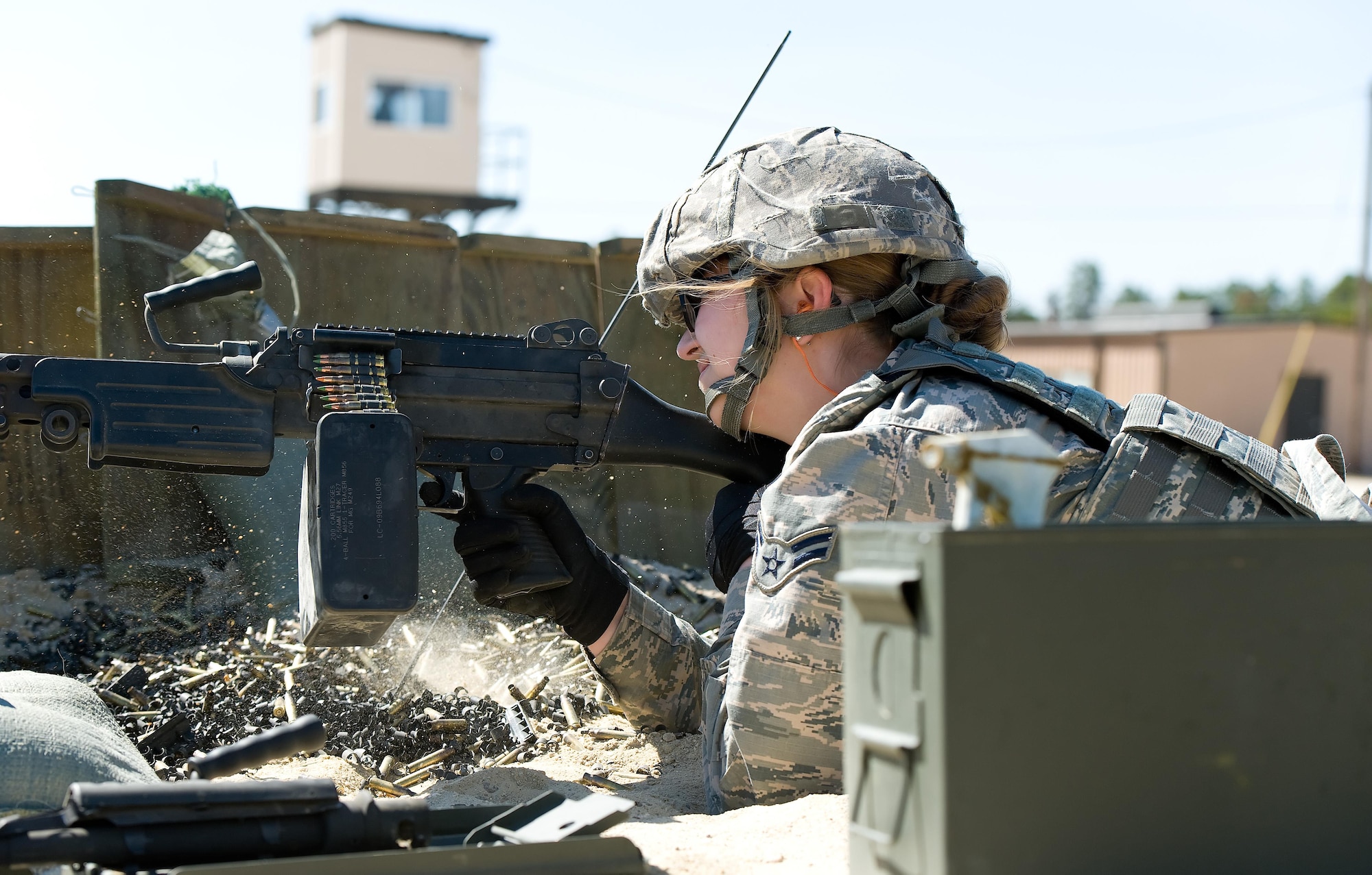 Airman 1st Class Annamae Prentiss, 436th Security Forces Squadron response force member, fires a M-249 Light Machine Gun at decommissioned tanks placed at various distances between 200 to 1,200 meters down range, March 9, 2017, at Range 7 on Joint Base McGuire-Dix-Lakehurst, N.J. Prentiss, assigned to Dover Air Force Base, Del., fired the M-249 loaded with 200 rounds of 5.56mm ammunition containing green-tipped frangible and orange/red-tipped tracer rounds placed in an assault pack. (U.S. Air Force photo by Roland Balik)