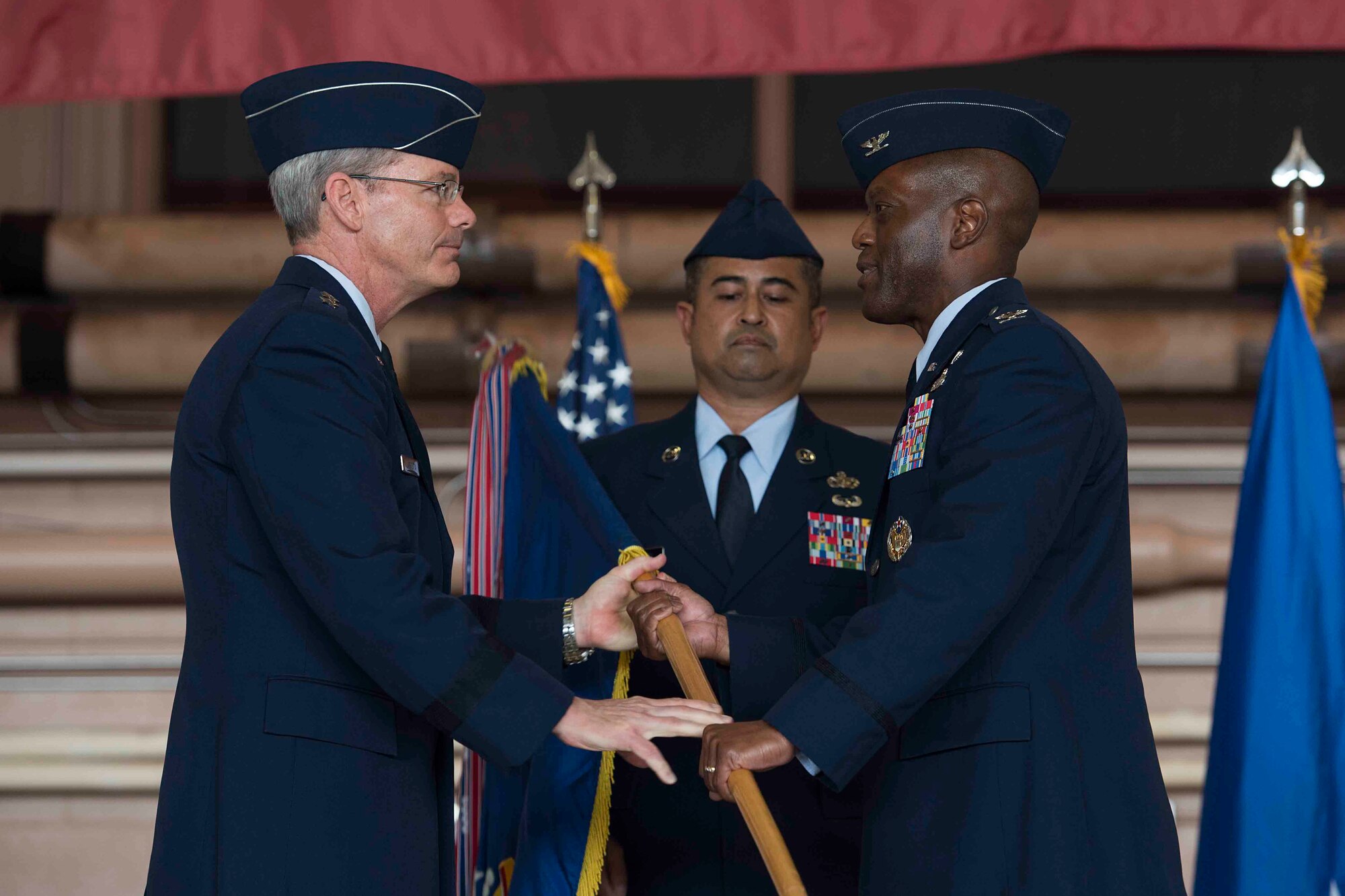 Maj. Gen. Robert Labrutta (left), 2nd Air Force commander, passes the ceremonial guidon to Col. Ronald Jolly (right), incoming 82nd Training Wing commander, during the 82nd Training Wing Change of Command ceremony at Sheppard Air Force Base, Texas, March 21, 2017. Jolly served at the Pentagon before arriving to Sheppard. (U.S. Air Force photo by Staff Sgt. Kyle E. Gese)