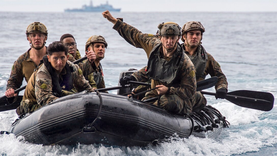 Marines navigate a combat rubber raiding craft into the well deck of the USS Bonhomme Richard after a helocast exercise in the Philippine Sea, March 19, 2017. The Bonhomme Richard Expeditionary Strike Group is on a routine patrol in the Indo-Asia-Pacific region. Navy photo by Petty Officer 3rd Class Jeanette Mullinax