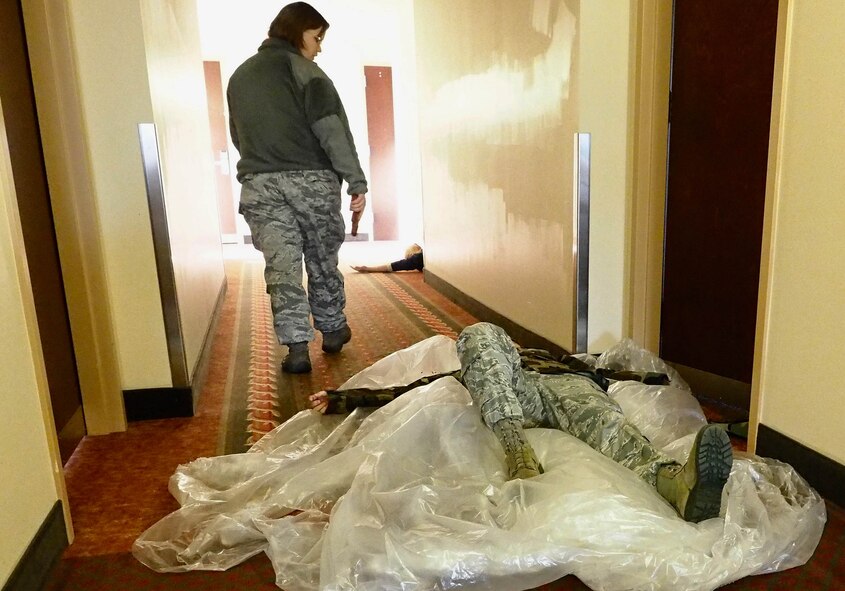 Tech. Sgt. Amy Lovgren, playing a disgruntled Airman, leaves a path of carnage during her rampage in the exercise.