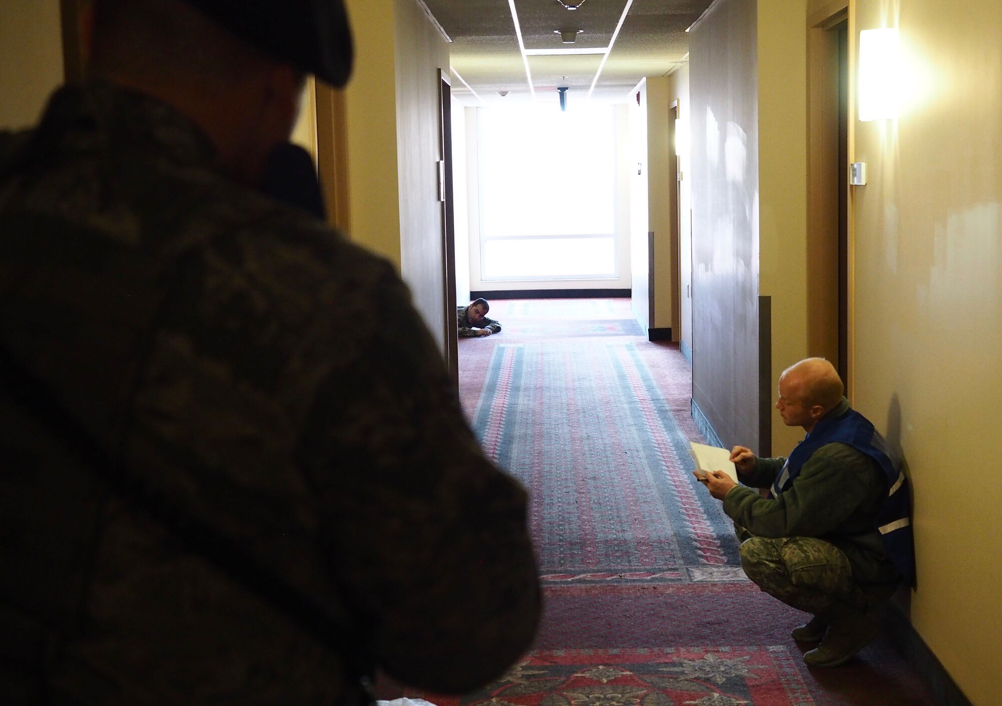 Maj. Judd Citrowske, a member of the Wing Inspection Team, takes notes as the scenario plays out.