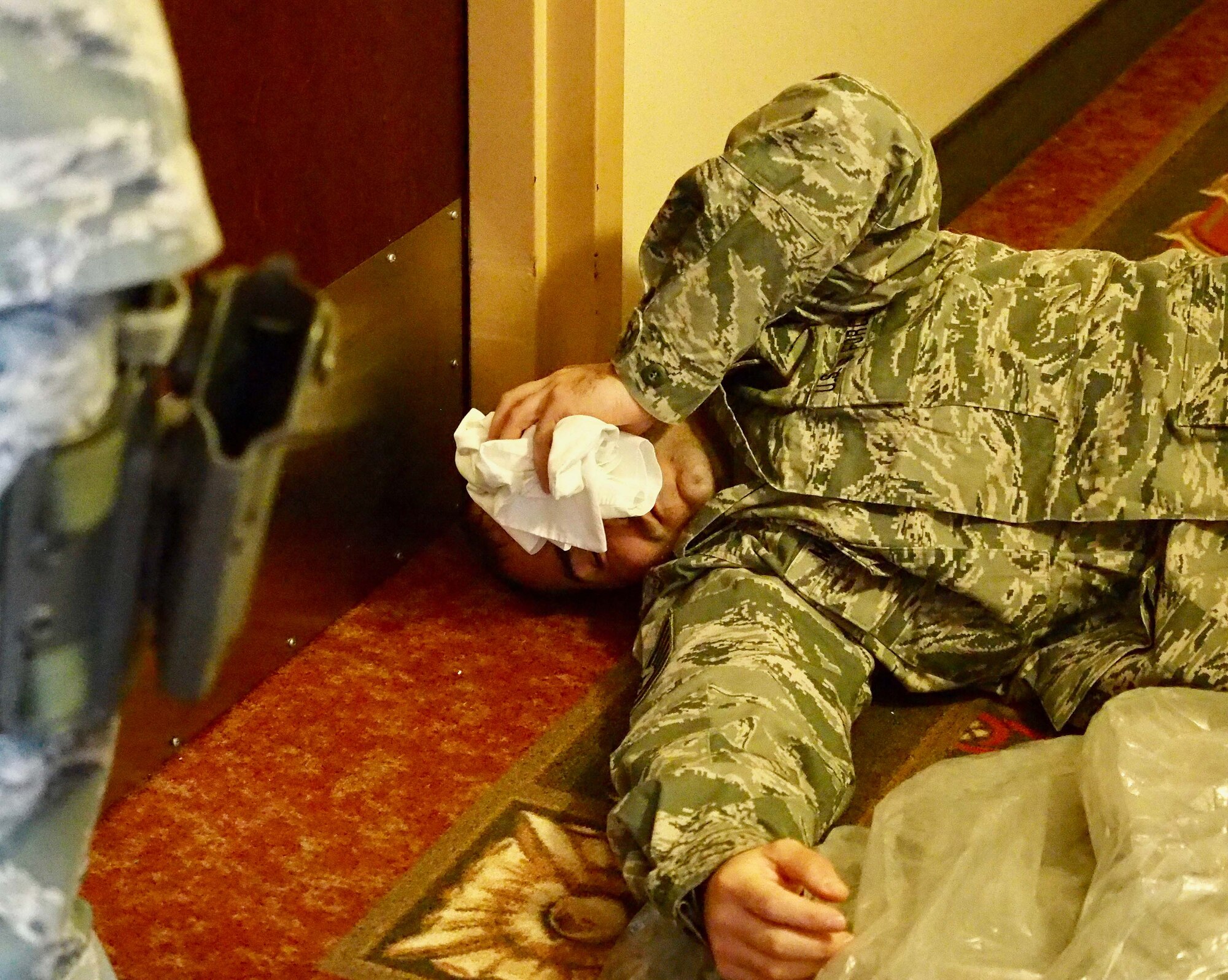 One of the building occupants suffers a gunshot wound to the head during the exercise.