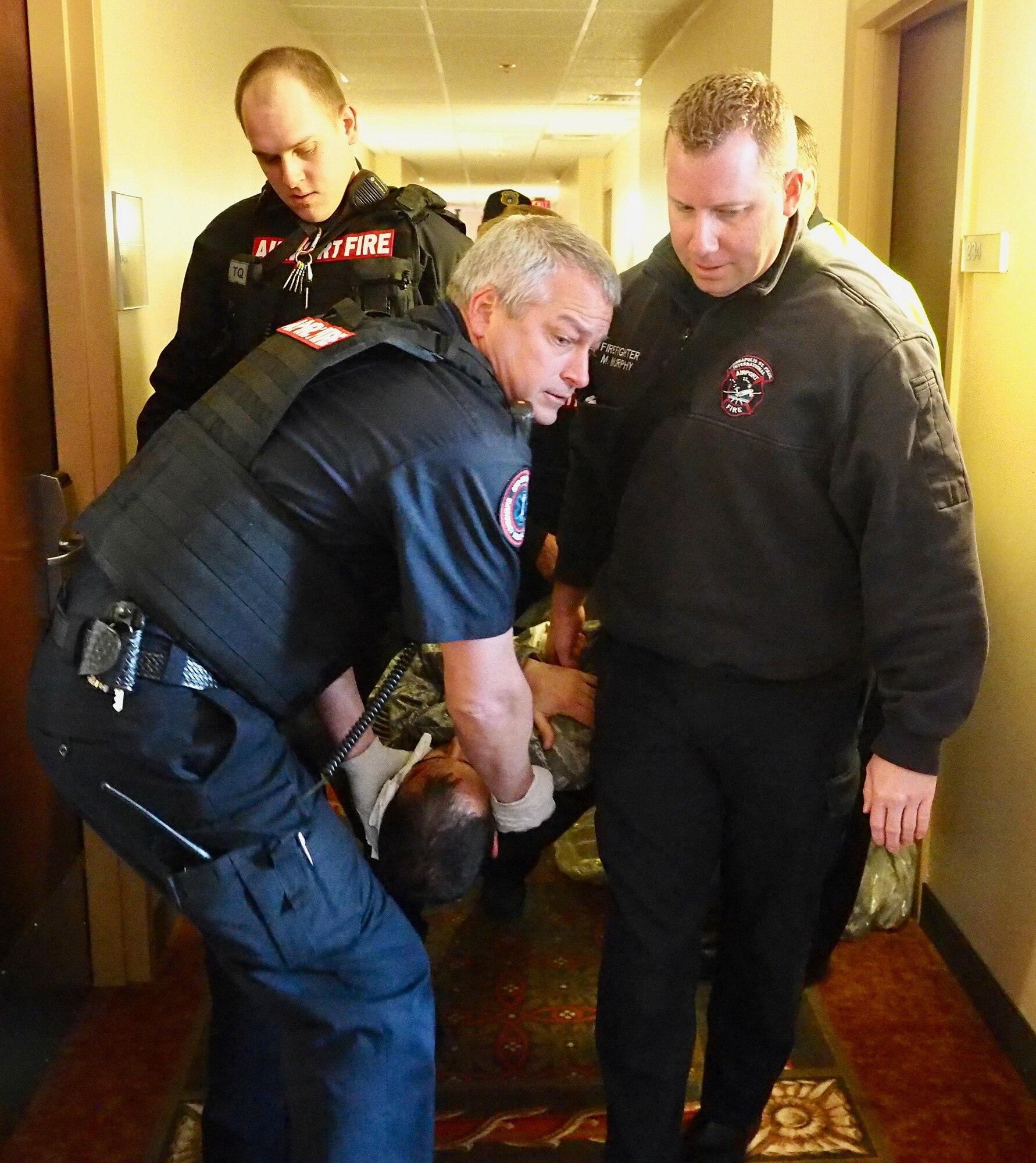MAC Fire Dept. members transport the wounded to a treatment facility during the exercise.