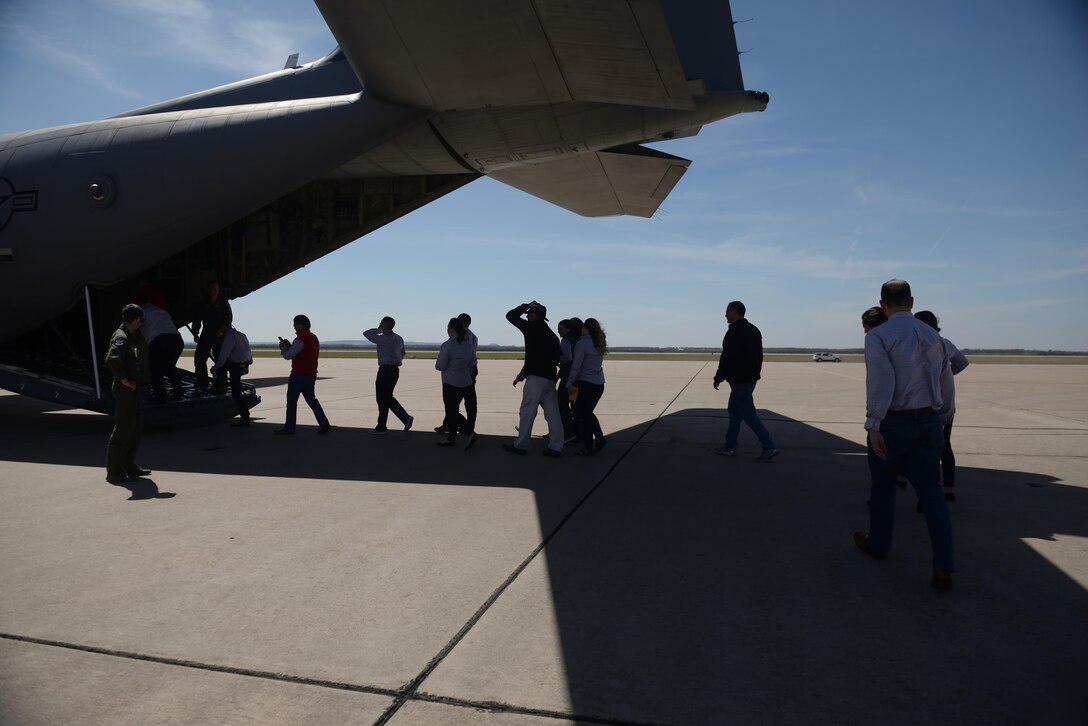 Leadership Abilene Class of 2017 students board a U.S. Air Force C-130J Super Hercules at Dyess Air Force Base, Texas, March 17, 2017. The flight, along with other work center visits made during the one-day tour, was designed to educate civic leaders on the importance of Team Dyess missions and its contributions to the city of Abilene. (U.S. Air Force photo by Airman 1st Class Rebecca Van Syoc)