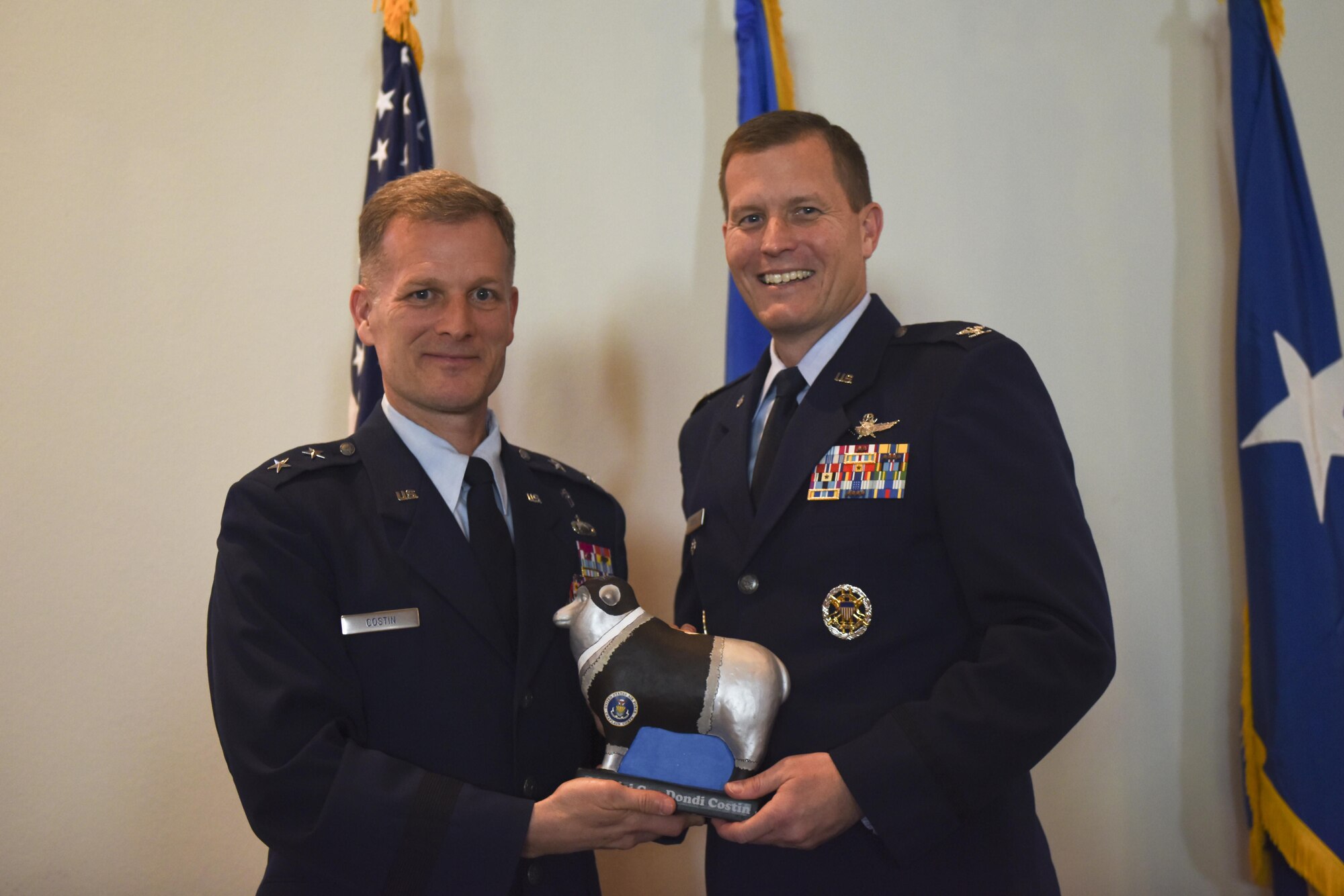 U.S. Air Force Col. Jeffrey Sorrell, 17th Training Wing Vice Commander, presents Chaplain (Maj. Gen.) Dondi Costin, Air Force Chief of Chaplains, with a miniature sheep at the Event Center on Goodfellow Air Force Base, Texas, March 15, 2017. The sheep represents the Doolittle Raiders and the local community’s main livestock. (U.S. Air Force photo by Airman 1st Class Chase Sousa/Released)