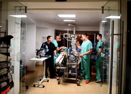 Team members from the 59th Medical Wing and the Army Institute of Surgical Research prepare a patient for transport from a hospital in South America to the San Antonio Military Medical Center in Texas, Feb. 16, 2017. The members of the medical team are part of the Defense Department’s only extracorporeal membrane oxygenation transport program run by the 59th Medical Wing. (U.S. Air Force photo/Staff Sgt. Jerilyn Quintanilla)