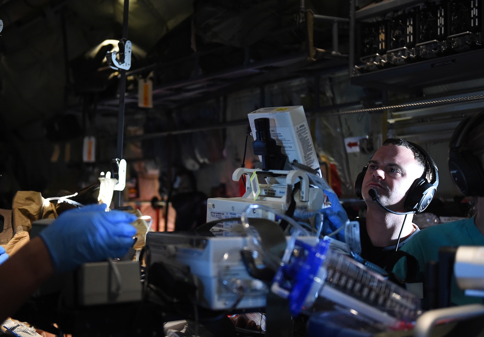 U.S. Air Force 1st Lt. Joseph Acquafredda, a 59th Medical Wing extracorporeal membrane oxygenation specialist, monitors the patient during flight on board a C-130J Super Hercules, Feb. 16, 2017. Acquafredda was part of a 9-person medical team tasked to transport a critically-ill patient from South America back to the U.S. for care at the San Antonio Military Medical Center in San Antonio, Texas. (U.S. Air Force photo/Staff Sgt. Jerilyn Quintanilla)