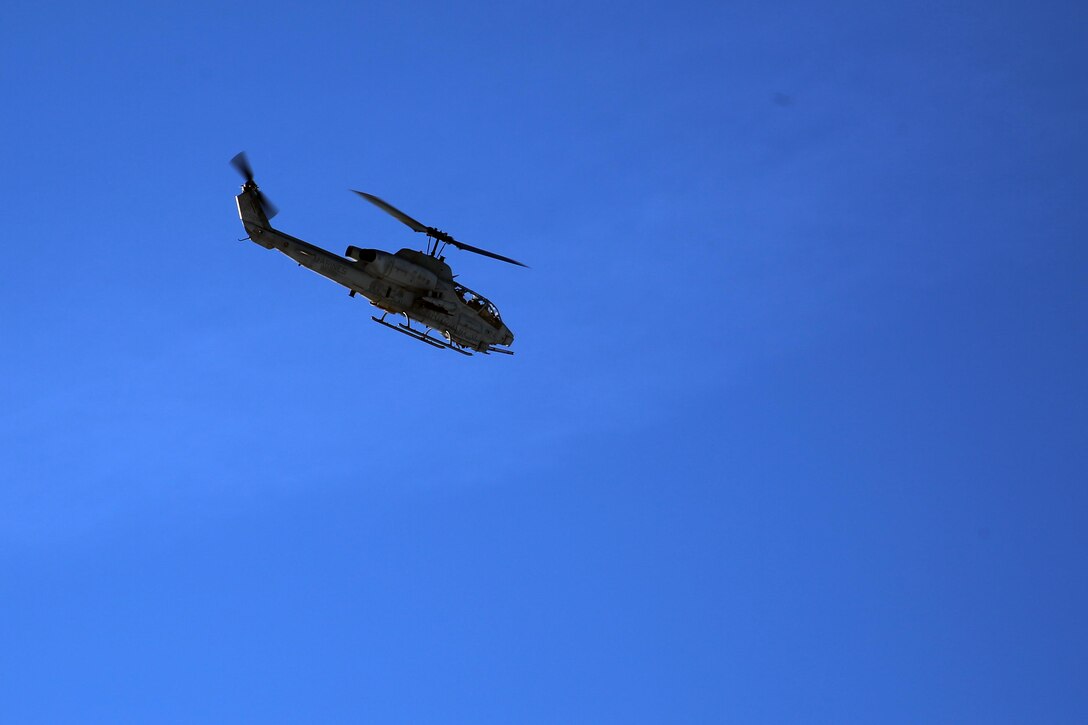 An AH-1W Super Cobra flies over a range during cold weather training operations near Fort Drum, N.Y., March 16, 2017. Marines assigned to Marine Light Attack Helicopter Squadron 269, Marine Aircraft Group 29, 2nd Marine Aircraft Wing, conducted close air support with live ordnance to simulate real world operations in a forward position. (U.S. Marine Corps photo by Cpl. Mackenzie Gibson/Released) 