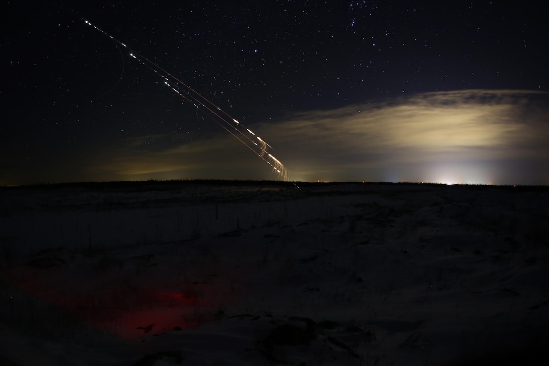 A UH-1Y Venom and an AH-1W Super Cobra shoot 2.75 inch rockets through the night sky and meet their targets during close air support training operations at a range near Fort Drum, N.Y., March 16, 2017. Marines assigned to 1st Air Naval Gunfire Liaison Company, I Marine Expeditionary Force Headquarters Group, I Marine Expeditionary Force, worked in conjunction with Marines assigned to Marine Light Attack Helicopter Squadron 269, Marine Aircraft Group 29, 2nd Marine Aircraft Wing, to complete their objectives. The training was conducted with live ordnance to simulate real world operations in a forward position. (U.S. Marine Corps photo by Cpl. Mackenzie Gibson/Released)