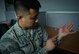 Staff Sgt. Srun Sookmeewiriya, 313th Expeditionary Operations Support Squadron NCO in charge of reports, points to scarring on his left wrist on Ramstein Air Base, Germany, Feb. 16, 2017. Sookmeewiriya attempted to commit suicide twice at a young age. He now shares his story occasionally to the public, encouraging struggling Airmen to seek help and be resilient.