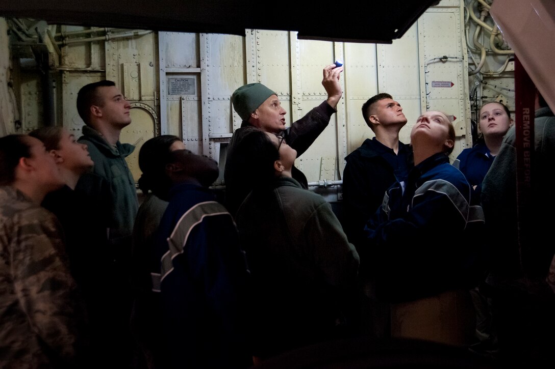 Lieutenant Col. Lanson Ross III, 459th Operations Group pilot, give a tour of a KC-135R Stratotanker at Joint Base Andrews, Maryland, March 21, 2017. The cadets had the opportunity to learn about the unit, its mission and the structure, function and capabilities of the KC-135. (U.S. Air Force photo/Tech. Sgt. Kat Justen)