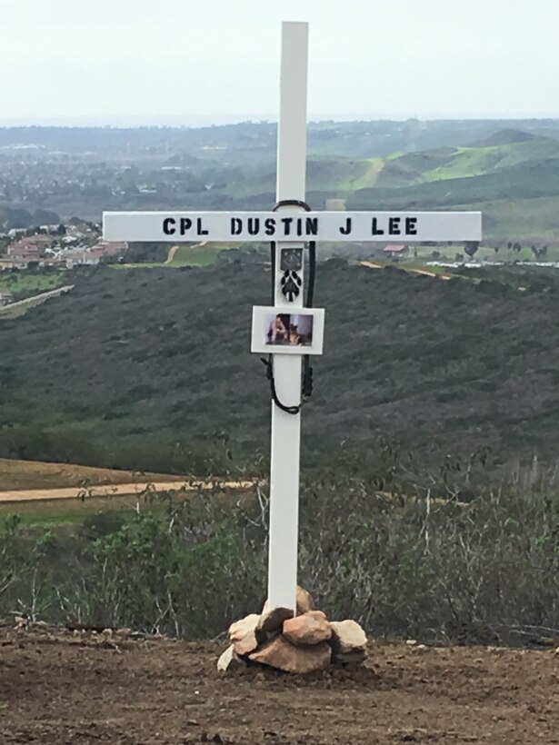 A cross bears the name of Cpl. Dustin Jerome Lee, former K9 handler, Marine Corps Logistics Base Albany, on K9 Hill aboard Camp Pendleton, Calif, serves as a reminder of his ultimate sacrifice. Lee, while attached to the 3rd Reconnaissance Battalion, Regimental Combat Team 6, II Marine Expeditionary Force, was killed in Fallujah, Iraq, March 21, 2007, during combat. 