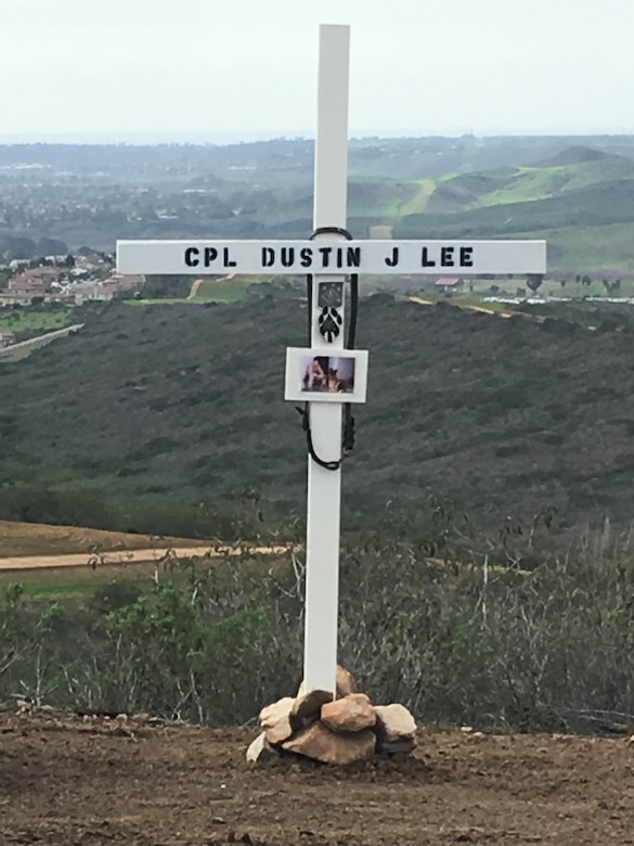 A cross bears the name of Cpl. Dustin Jerome Lee, former K9 handler, Marine Corps Logistics Base Albany, on K9 Hill aboard Camp Pendleton, Calif, serves as a reminder of his ultimate sacrifice. Lee, while attached to the 3rd Reconnaissance Battalion, Regimental Combat Team 6, II Marine Expeditionary Force, was killed in Fallujah, Iraq, March 21, 2007, during combat. 