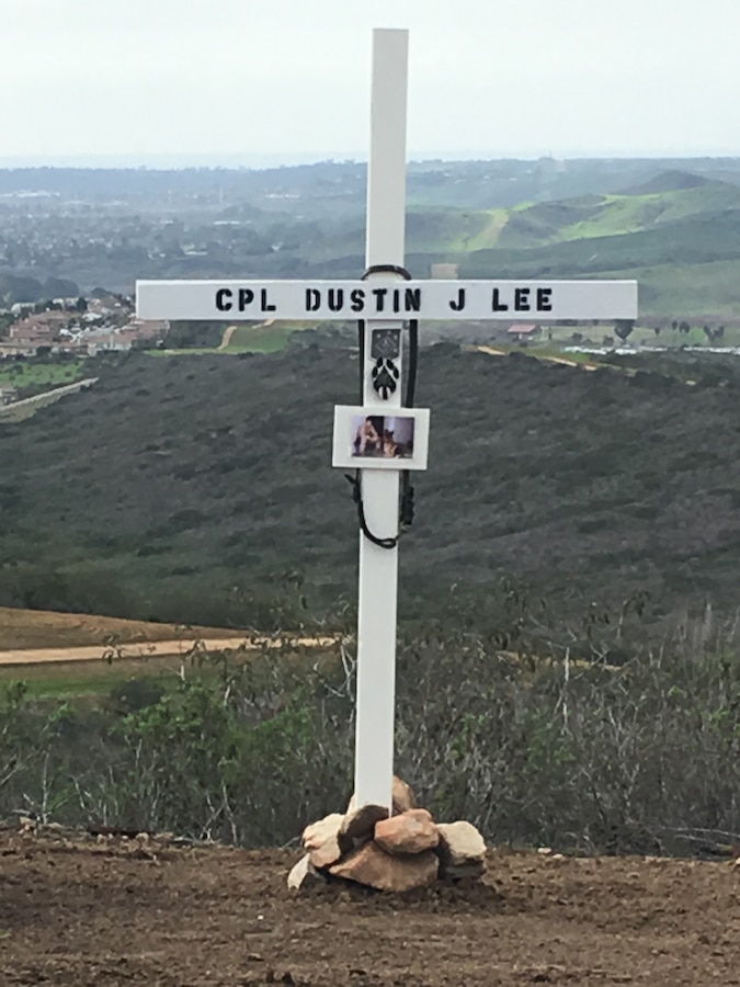 A cross bears the name of Cpl. Dustin Jerome Lee, former K9 handler, Marine Corps Logistics Base Albany, on K9 Hill aboard Camp Pendleton, Calif, serves as a reminder of his ultimate sacrifice. Lee, while attached to the 3rd Reconnaissance Battalion, Regimental Combat Team 6, II Marine Expeditionary Force, was killed in Fallujah, Iraq, March 21, 2007, during combat. 