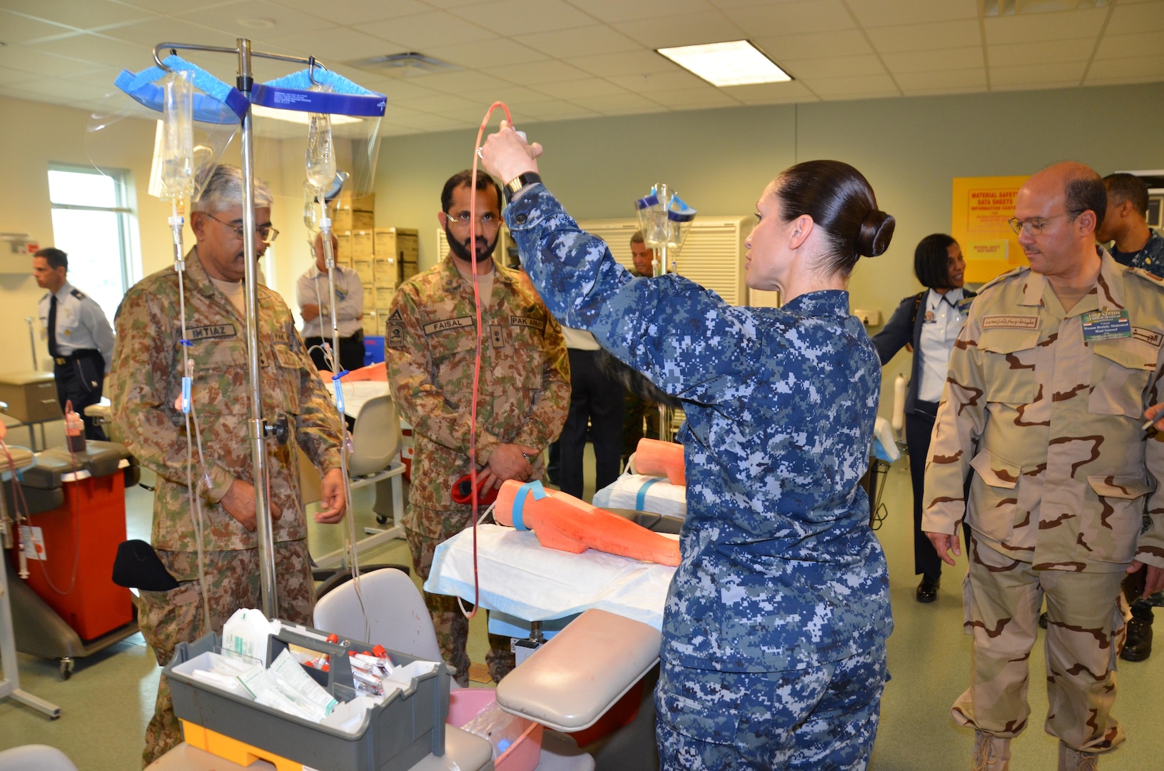 Participants in the CENTCOM Theater Medical Conference tour the “dead stick lab”, which is a laboratory used in the Basic Medical Technician Corpsman Program, where students practice intravenous (IV) and venipuncture skills on simulated arms. Medical professionals representing more than 10 countries within the US Central Command area of operation, Europe, and the U.S. attended the conference to aid in the continued development of capabilities that will serve to improve regional interoperability and cooperation. (Medical Education and Training Campus Public Affairs photo by Lisa Braun/Released)