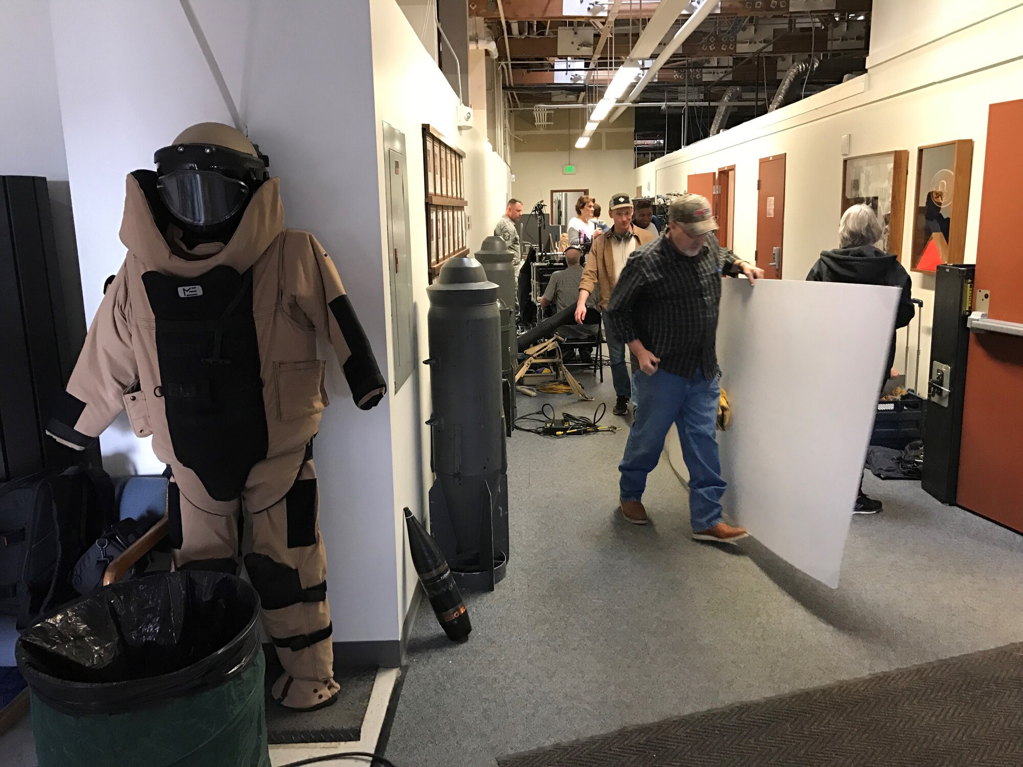 PETERSON AIR FORCE BASE, Colo. - A film crew working the Center of Excellence for Medical Multimedia from the United States Air Force Academy preps the make shift film set hosted at the Explosive Ordnance Disposal building at Peterson Air Force Base, Colorado, March 15, 2017. The film crew was shooting a training video addressing how to recognize symptoms of post-traumatic stress disorder and depression in Airmen.  (U.S. Air Force photo by Tech. Sgt. Joshua Arends)