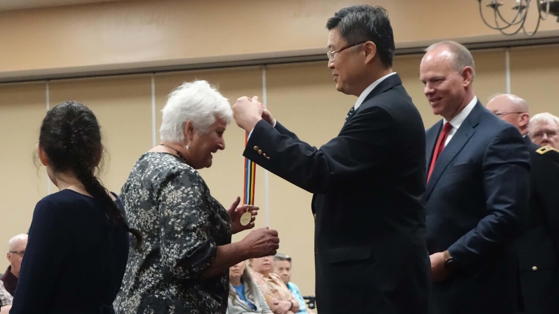 Shin Chae-Hyun, Consul General of the Republic of Korea in San Francisco, presents the South Korea Veterans Ambassador for Peace Medal to the family member of a Korean War veteran during an award ceremony at the Ramkota Hotel in Casper, WY, March 20, 2017. The state of Wyoming, along with Chae-Hyun, have awarded more than 280 medals in the past three years, with more than 40 of those issued during the recent ceremony in Casper.