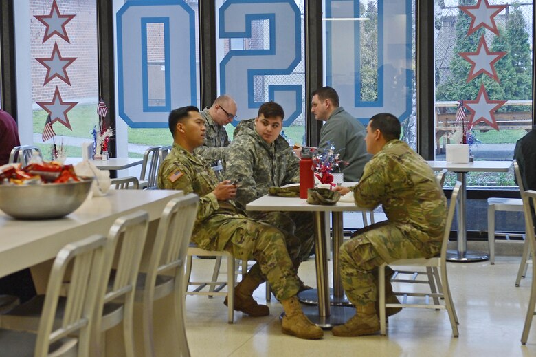 Airmen and Soldiers assigned to Joint Base Lewis-McChord, Wash., eat lunch at the United Service Organizations Northwest Shali Center Mar. 21, 2017 at JBLM. The USO Northwest has been servicing the surrounding area since 1966 and continues to serve the men and women of JBLM today. (U.S. Air Force/Senior Airman Divine Cox)