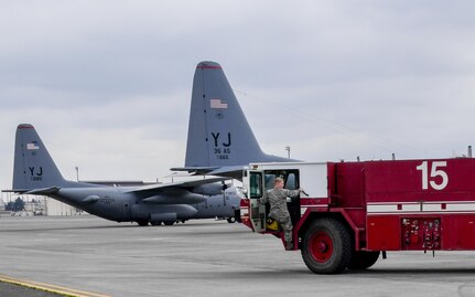 Senior Airman Aubrey Rice, 374th Civil Engineering Squadron driver operator, gets into a P-19 firetruck on the flight line after returning from Exercise Cope North Guam, March 14, 2017, at Yokota Air Base, Japan. The firetruck was used to provide flight line support during the exercise. 