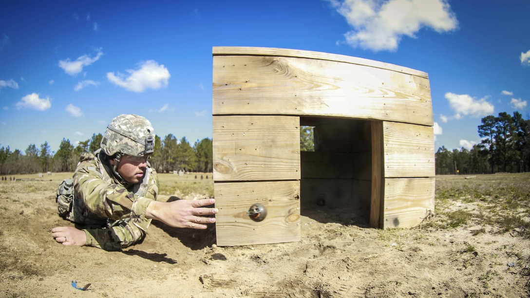 A soldier throws a simulated M67 fragmentation hand grenade into a bunker during a training event at Fort Bragg, N.C., March 19, 2017. Army photo by Sgt. Steven Galimore