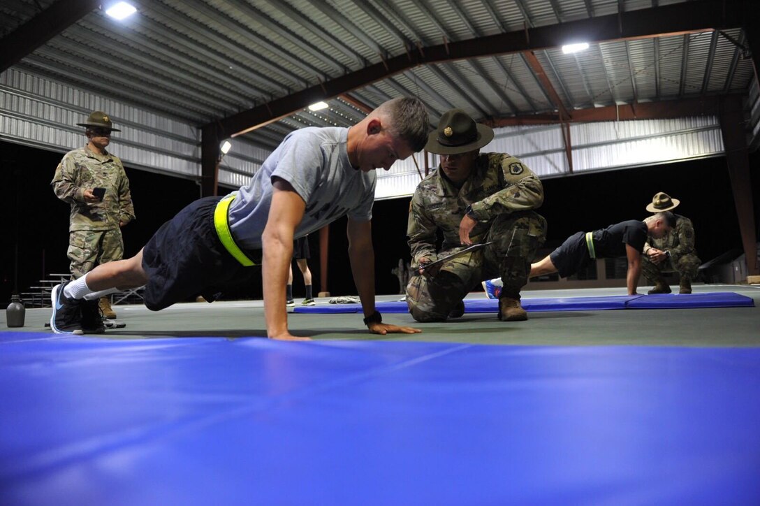 Sgt. Richard Lopez performs the push-ups event during the Army Physical Fitness Test  of the 1st Mission Support Command Best Warrior Competition at Camp Santiago, Puerto Rico. March 14