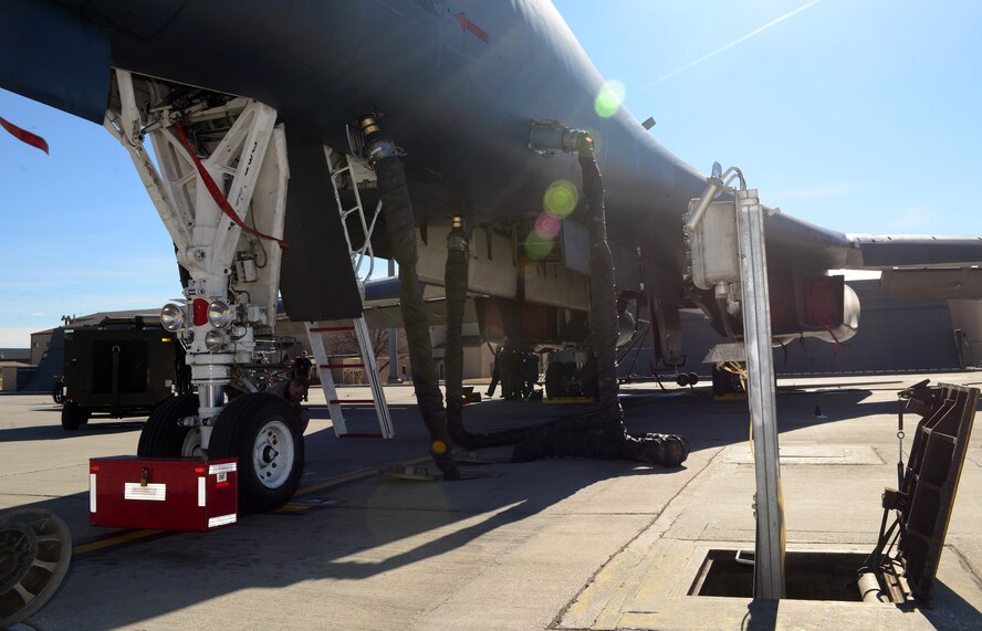 A B-1 bomber is hooked up to the Consolidated Aircraft Support System at Ellsworth Air Force Base, S.D., March 16, 2017. The CASS is made up of multiple structures and parts beneath the flight line used to provide both air and power to support the B-1 during pre-flight inspections. (U.S. Air Force photo by Airman 1st Class Donald C. Knechtel)
