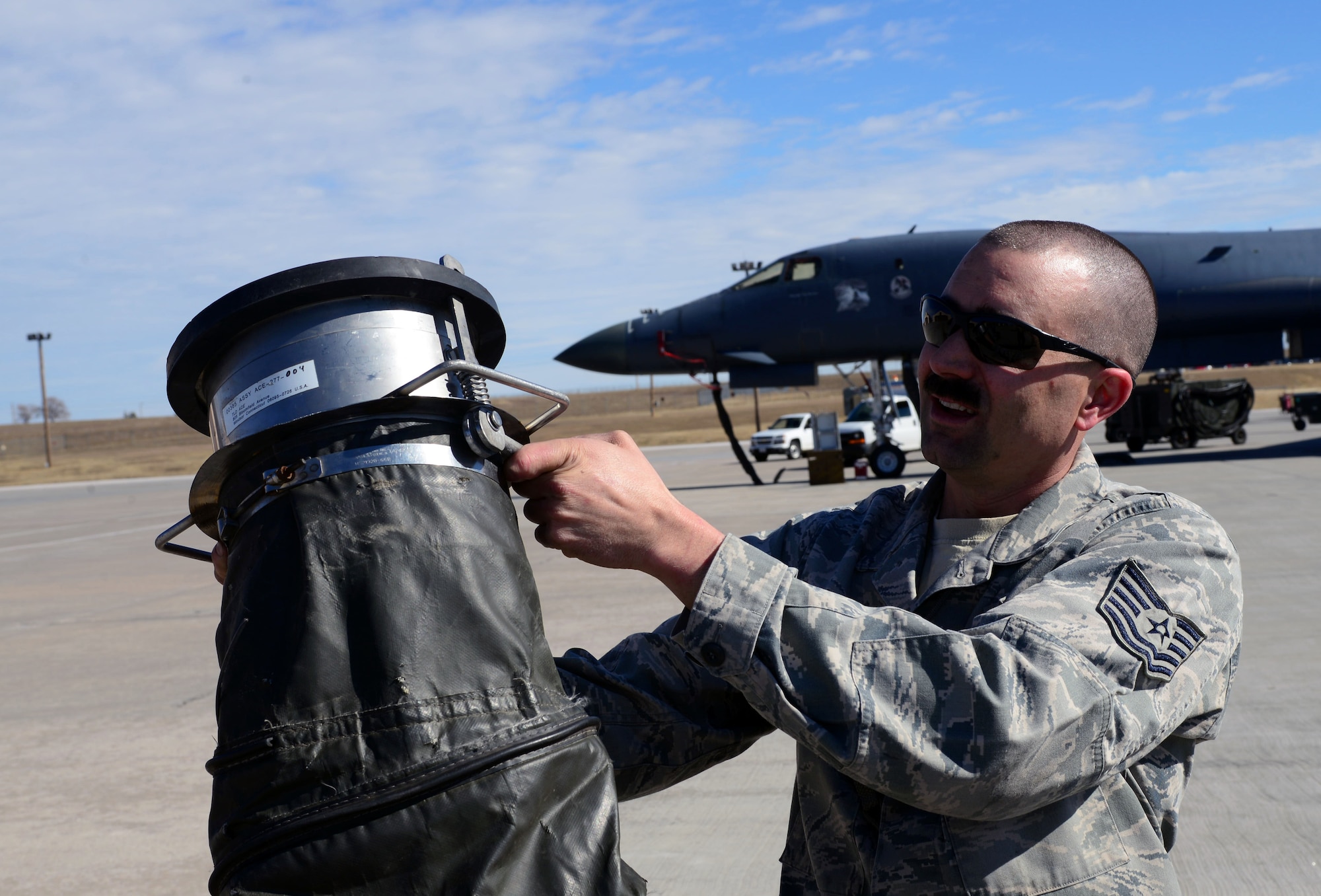 Tech. Sgt. Caleb Warren, an aerospace ground equipment craftsman assigned to the 28th Maintenance Squadron, holds up a Consolidated Aircraft Support System air valve at Ellsworth Air Force Base, S.D., March 16, 2017. Over the course of the last 10 years the 28th Civil Engineer Squadron and 28th MXS have put more than $500,000 worth of modifications into CASS in order to keep it running. (U.S. Air Force photo by Airman 1st Class Donald C. Knechtel)