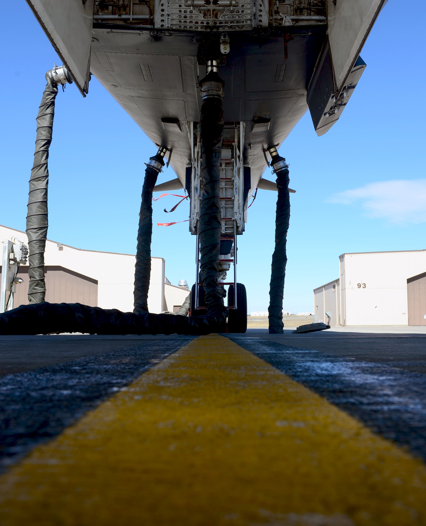 A B-1 bomber is hooked up to the Consolidated Aircraft Support System at Ellsworth Air Force Base, S.D., March 16, 2017.  Compared to the 20,000 pound air conditioner previously used for pre-flight, CASS is virtually quite, allowing maintainers to communicate more effectively during pre-flight inspections. (U.S. Air Force photo by Airman 1st Class Donald C. Knechtel)