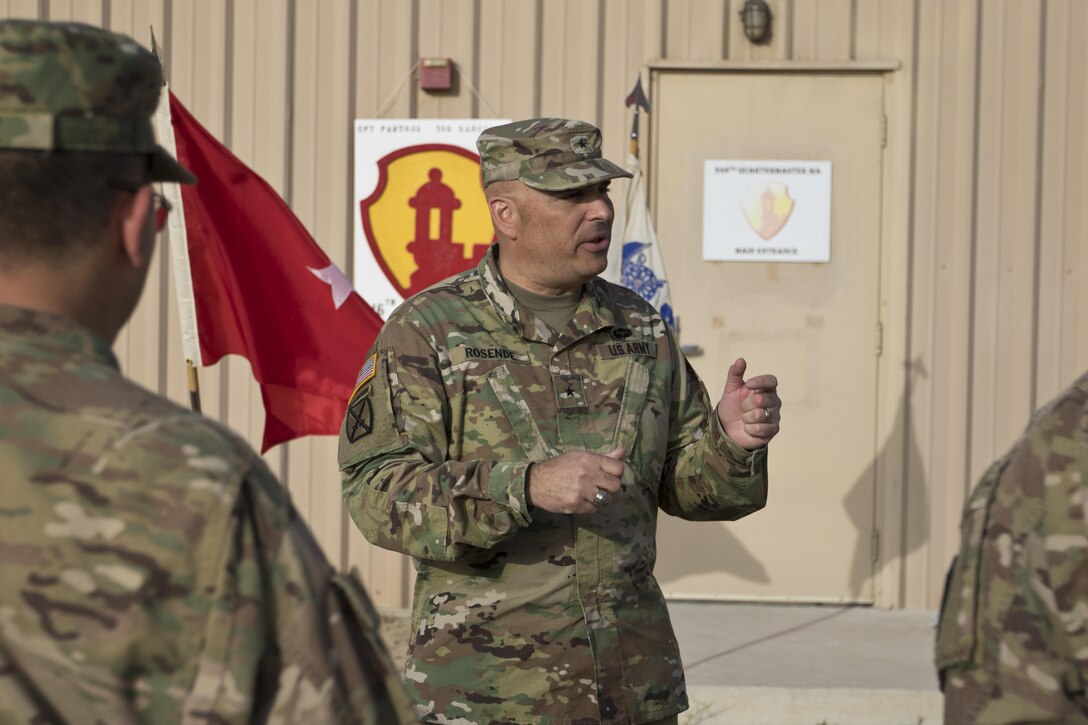 Brig. Gen. Alberto Rosende, commanding general of the 1st Mission Support Command, an Army Reserve unit based out of Fort Buchanan, Puerto Rico, talks about the importance of the combat shoulder sleeve insignia before a patching ceremony for the 246th Quartermaster Company (Mortuary Affairs) at Camp Arifjan, Kuwait, on Mar. 20, 2017. (U.S. Army photo by Staff Sgt. Dalton Smith)