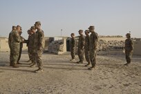 Brig. Gen. Alberto Rosende, commanding general of the 1st Mission Support Command, an Army Reserve unit based out of Fort Buchanan, Puerto Rico, puts the Garita patch on Soldiers during a patching ceremony for the 246th Quartermaster Company (Mortuary Affairs) at Camp Arifjan, Kuwait, on Mar. 20, 2017. (U.S. Army photo by Staff Sgt. Dalton Smith)