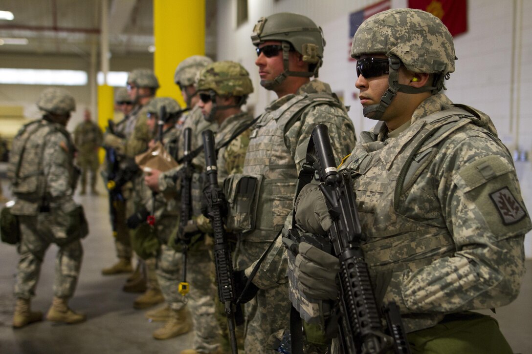 U.S. Army Reserve Soldiers assigned to the 423rd Military Police Company, 333rd Military Police Brigade, 200th Military Police Command, prepare for upcoming airlift mission on March 19, 2017, at McGuire-Dix-Lakehurst, N.J. The military police unit worked with the U.S. Air Force 621st Contingency Response Wing and the U.S. Air Force Reserve 732nd Airlift Squadron to complete a joint airlift mission during Warrior Exercise 78-17-01 which is designed to assess a units’ combat capabilities. Roughly 60 units from the U.S. Army Reserve, U.S. Army, U.S. Air Force, and Canadian Armed Forces are participating in the 84th Training Command’s joint training exercise, WAREX 78-17-01, at Joint Base McGuire-Dix-Lakehurst from March 8 until April 1, 2017; the WAREX is a large-scale collective training event designed to simulate real-world scenarios as America’s Army Reserve continues to build the most capable, combat-ready, and lethal Federal Reserve force in the history of the Nation. (Army Reserve Photo by Sgt. Stephanie Ramirez/ Released)