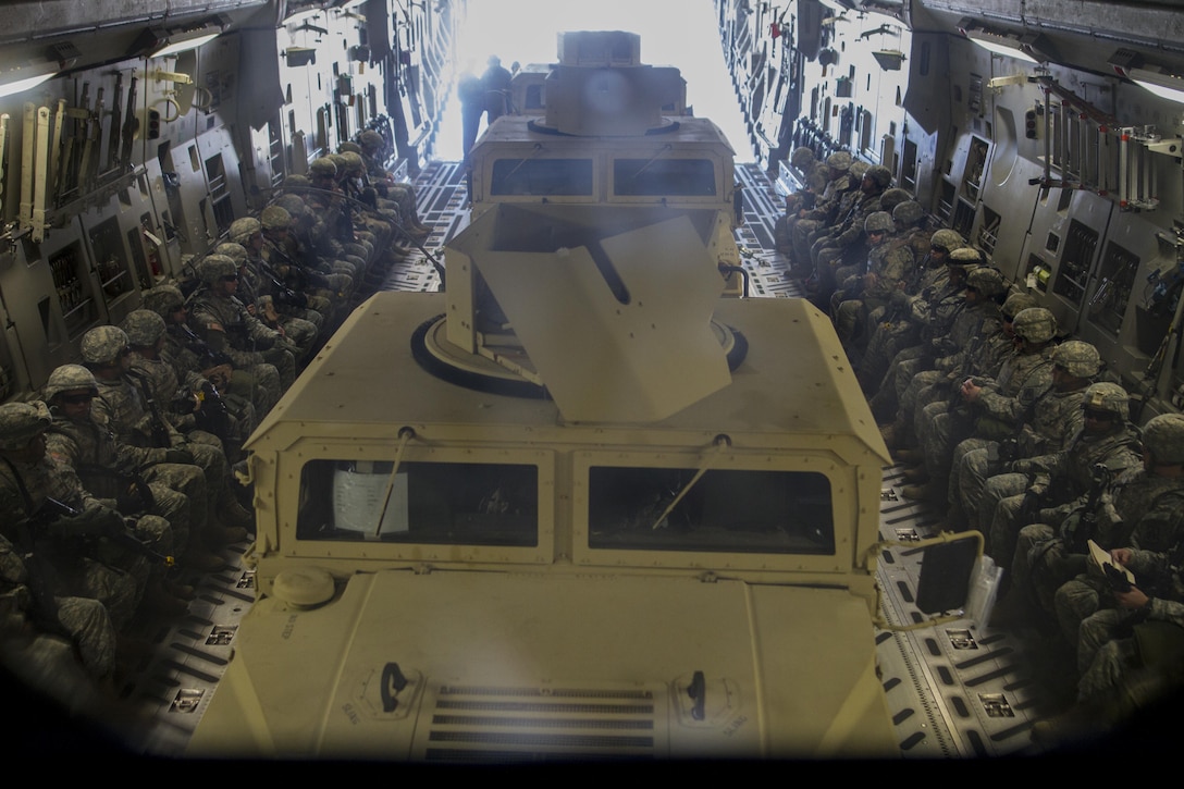 U.S. Army Reserve Soldiers assigned to the 423rd Military Police Company, 333rd Military Police Brigade, 200th Military Police Command, load a on an Air Force C-17 Globemaster on March 19, 2017, at McGuire-Dix-Lakehurst, N.J. The military police unit worked with the U.S. Air Force 621st Contingency Response Wing and the U.S. Air Force Reserve 732nd Airlift Squadron to complete a joint airlift mission during Warrior Exercise 78-17-01 which is designed to assess a units’ combat capabilities. Roughly 60 units from the U.S. Army Reserve, U.S. Army, U.S. Air Force, and Canadian Armed Forces are participating in the 84th Training Command’s joint training exercise, WAREX 78-17-01, at Joint Base McGuire-Dix-Lakehurst from March 8 until April 1, 2017; the WAREX is a large-scale collective training event designed to simulate real-world scenarios as America’s Army Reserve continues to build the most capable, combat-ready, and lethal Federal Reserve force in the history of the Nation. (Army Reserve Photo by Sgt. Stephanie Ramirez/ Released)