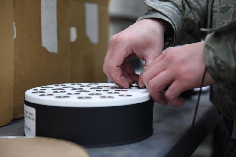 A 62nd Maintenance Squadron conventional maintenance Airman builds up the flare systems for the C-17 Globemaster III at Joint Base Lewis-McChord, Wash., March 14, 2017. The 62nd MXS tracks, manages and maintains the flare systems for the 48 C-17s assigned to McChord, whether here at home station or around the world. (Air Force photo/ Staff Sgt. Naomi Shipley)