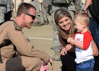 After a six-month deployment, an Airman and his family are reunited at Barksdale Air Force Base, La., March 21, 2017. More than 400 Airmen who returned have already been replaced by more Airmen who continue to perform B-52 operations overseas in the U.S. Air Forces Central Command. (U.S. Air Force photo/Senior Airman Curt Beach)