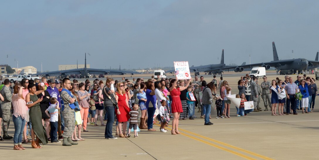 Family and friends await the return of deployed Airmen to Barksdale Air Force Base, La., March 21, 2017. More than 400 Barksdale Airmen returned from their deployment to Al Udeid Air Base, Qatar, where they supported Operation Inherent Resolve in the fight against ISIS. (U.S. Air Force photo/Senior Airman Curt Beach)