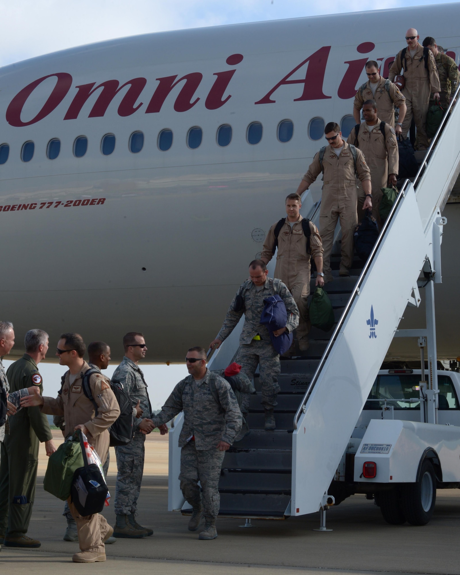 Members of Team Barksdale welcome home Airmen upon their return from deployment at Barksdale Air Force Base, La., March 21, 2017. Barksdale Airmen joined U.S. Air Forces Central Command in the mission to defeat and ultimately destroy ISIS through mutual support of regional forces. Since September 2016, Barksdale B-52 Stratofortresses and Airmen have flown over 400 sorties, dropped more than 2,500 weapons totaling approximately two million pounds, and executed more than 2,000 strikes against ISIS. (U.S. Air Force photo/Senior Airman Curt Beach)