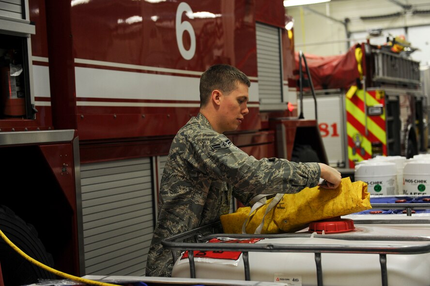 U.S. Air Force Airman 1st Class Sean Whittaker, a 354th Civil Engineer Squadron firefighter, inspects equipment March 13, 2017, at Eielson Air Force Base, Alaska. At the beginning of each shift firemen are responsible for checking their equipment to ensure it functions properly. (U.S. Air Force photo by Airman 1st Class Isaac Johnson)